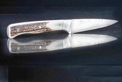 Steiger Messer und Manschettenknöpfe